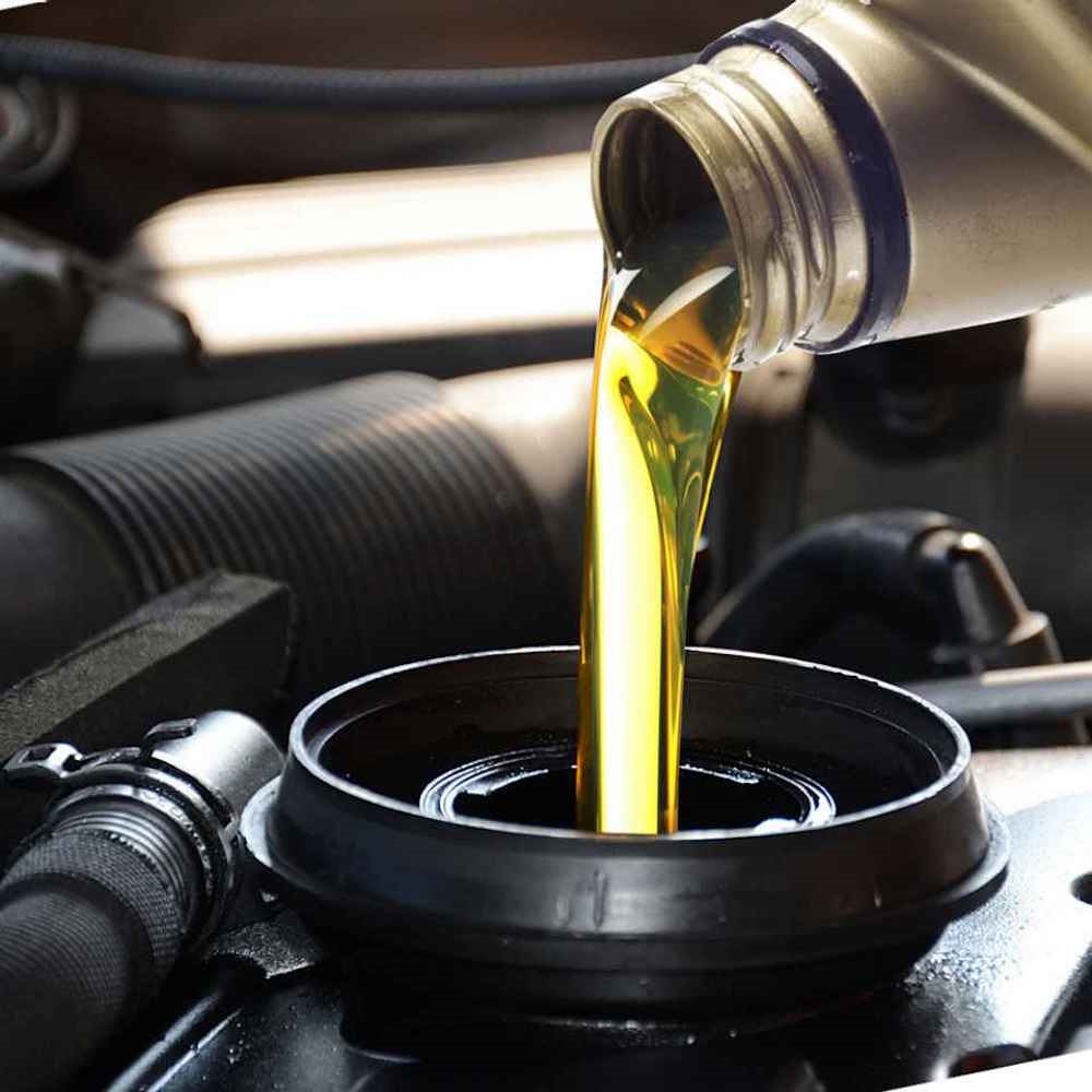 Fresh oil being poured during an oil change